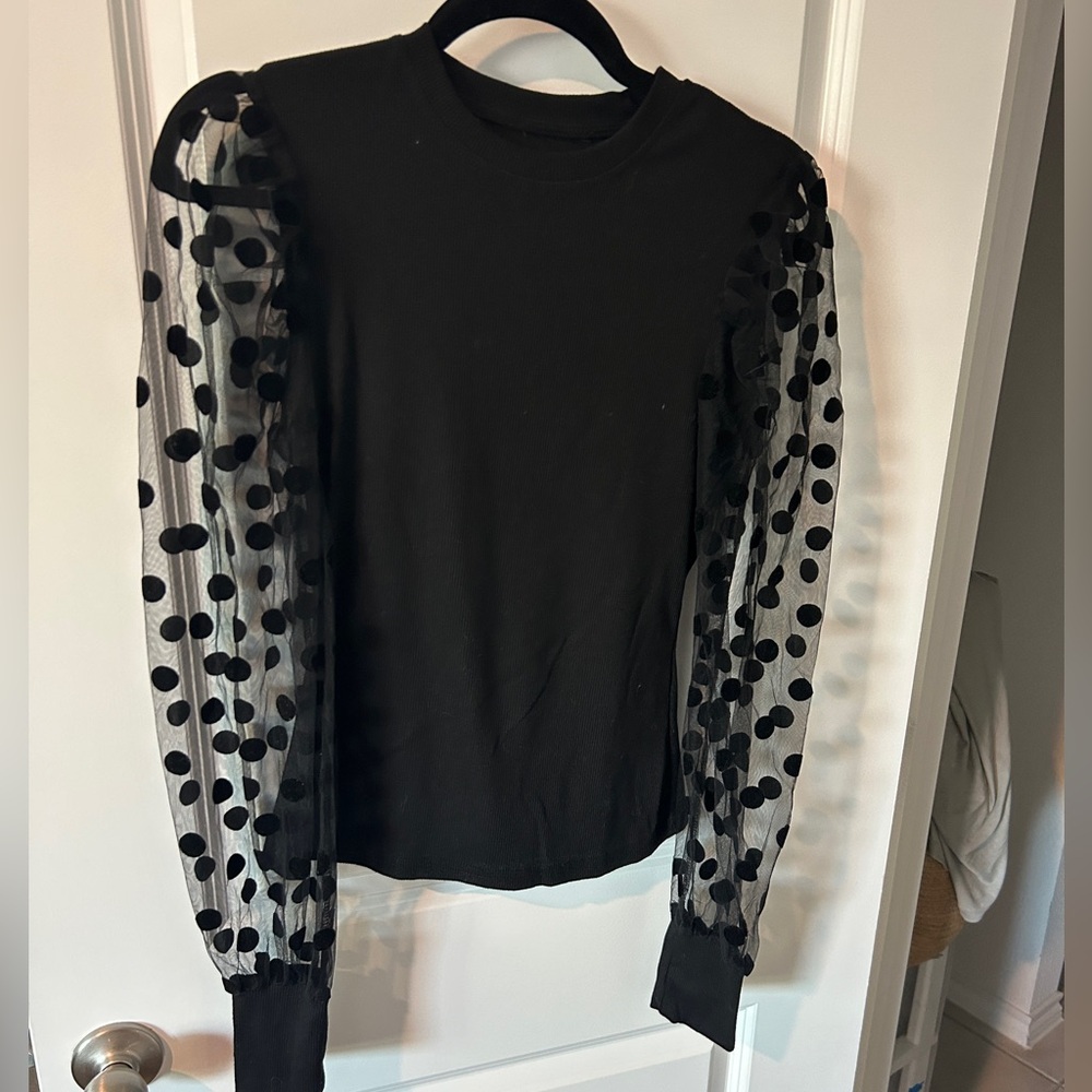 Black top with polkadot sheer sleeves